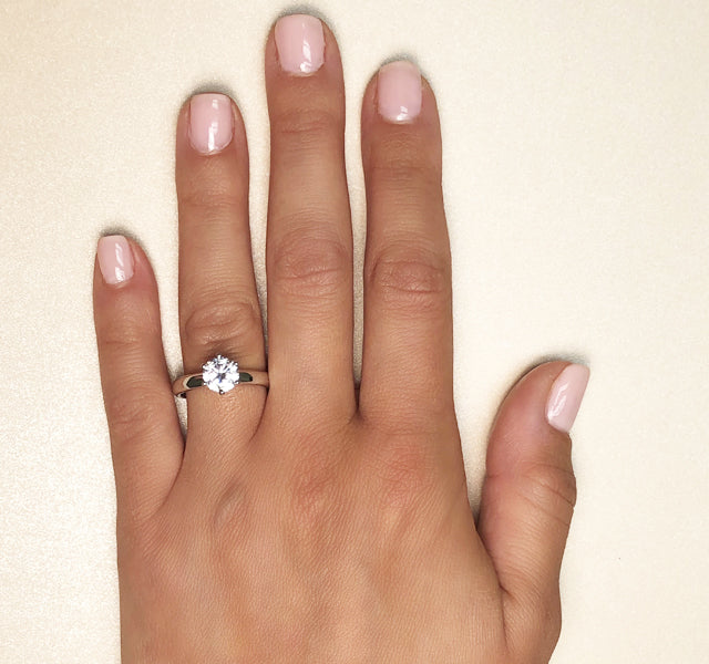 MJ Tried & True high polished solitaire style setting with 3...